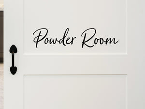 Wall decals for bathroom that say ‘Powder Room’ in a script font on a bathroom door.