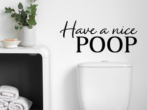 Wall decals for bathroom that say ‘Have A Nice Poop’ in a script font on a bathroom wall.