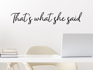 Wall decal for the office that says ‘That's What She Said’ in a cursive font on an office wall.