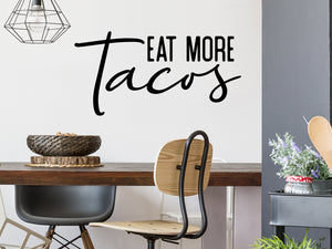 Wall decals for kitchen that say ‘Eat More Tacos’ on a kitchen wall.
