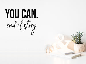 Wall decal for the office that says ‘You Can End Of Story’ in a bold font on an office wall.