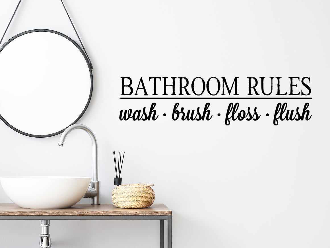 Wall decals for bathroom that say ‘Bathroom Rules Wash Brush Floss Flush’ in a print font on a bathroom wall.