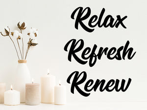 Wall decals for bathroom that say ‘relax refresh renew’ on a bathroom wall.