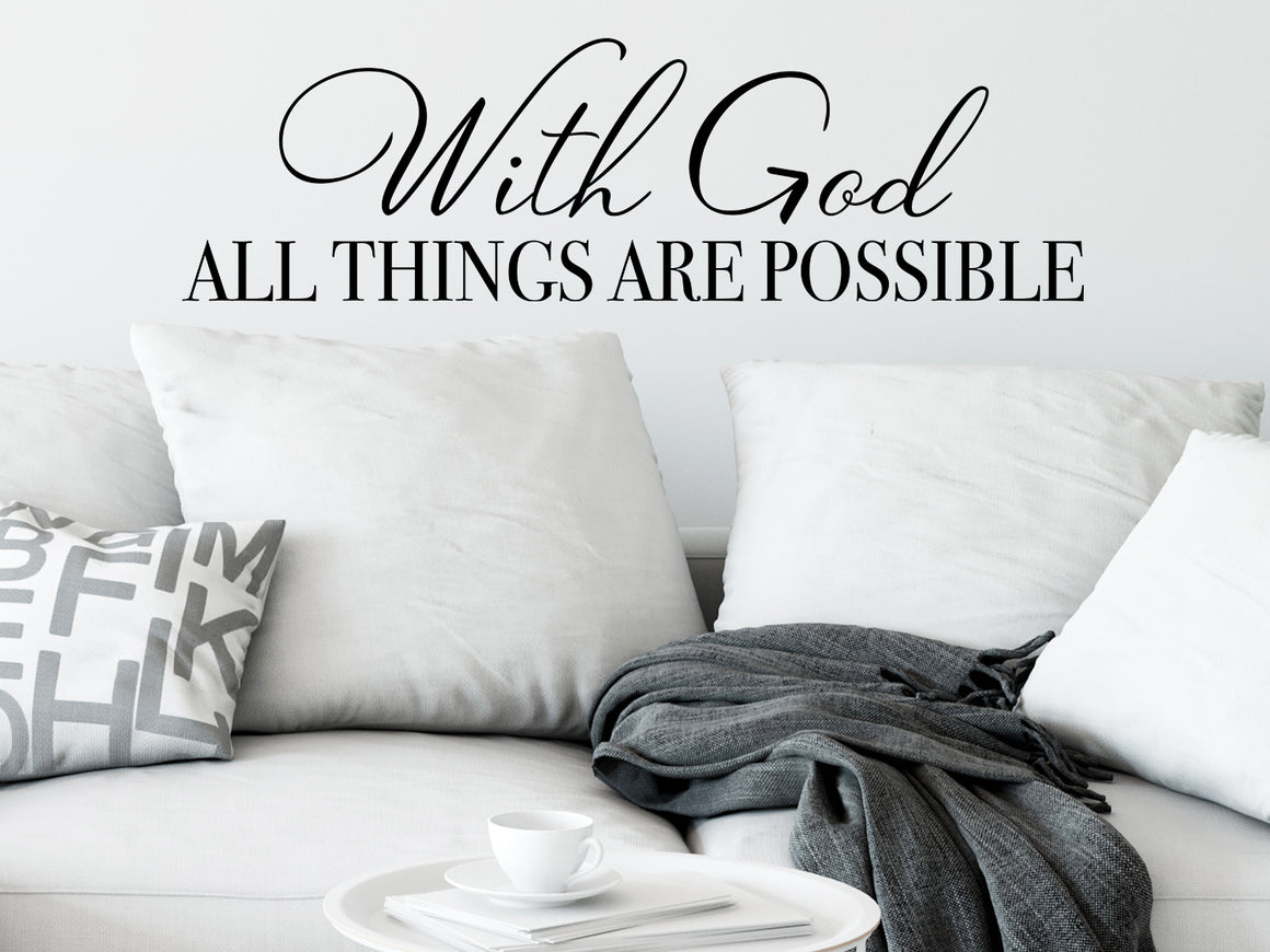 Living room wall decals that say ‘With God all things are possible’ on a living room wall. 