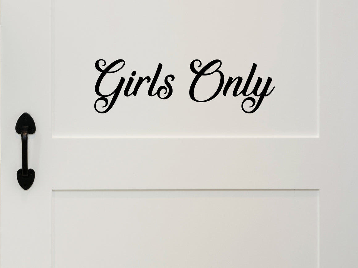 Wall decal for kids that says ‘Girls Only’ in a cursive font on a kid’s room wall. 