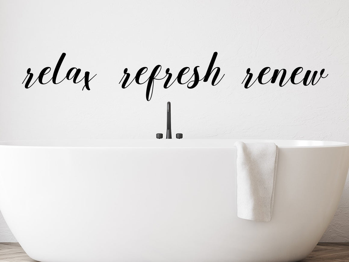 Wall decals for bathroom that say ‘relax refresh renew’ on a bathroom wall.