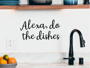 Wall decals for kitchen that say ‘Alexa Do The Dishes’ in a cursive font on a kitchen wall.