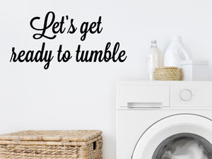 Laundry room wall decal that says ‘Let's Get Ready To Tumble’ on a laundry room wall
