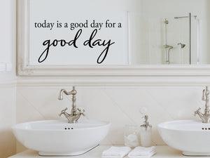 Wall decals for bathroom that say ‘Today Is A Good Day For A Good Day’ in a script font on a bathroom wall.
