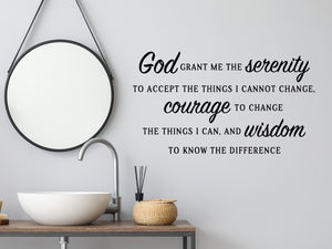 Wall decals for bathroom that say ‘God Grant Me The Serenity’ in a script font on a bathroom wall.