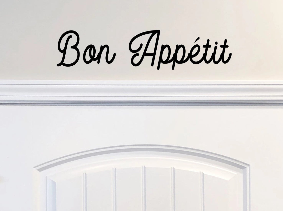 Wall decals for kitchen that say ‘Bon Appetit’ on a kitchen wall.