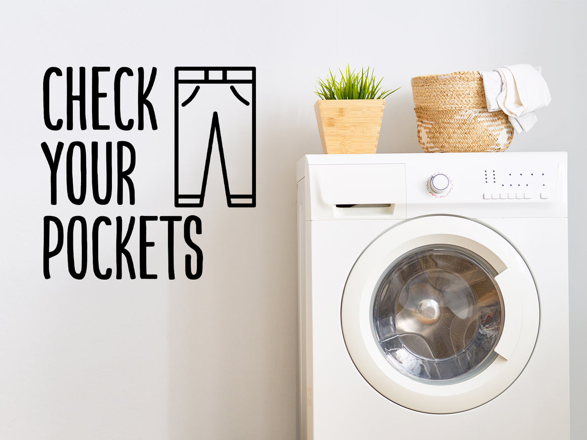 Laundry room wall decal that says ‘Check your pockets’ on a laundry room wall.