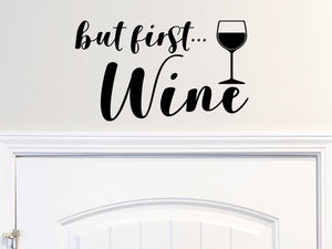 Wall decals for kitchen that say ‘but first wine’ on a kitchen wall.