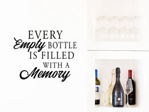Wall decals for kitchen that say ‘every empty bottle is filled with a memory’ on a kitchen wall.