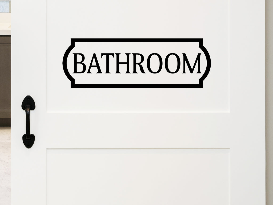 Wall decals for bathroom that say ‘bathroom’ with a plaque design on a bathroom wall.