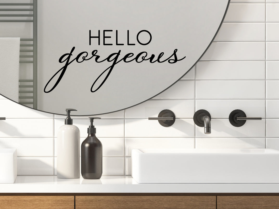 Wall decals for bathroom that say ‘Hello Gorgeous’ in a cursive font on a bathroom wall.