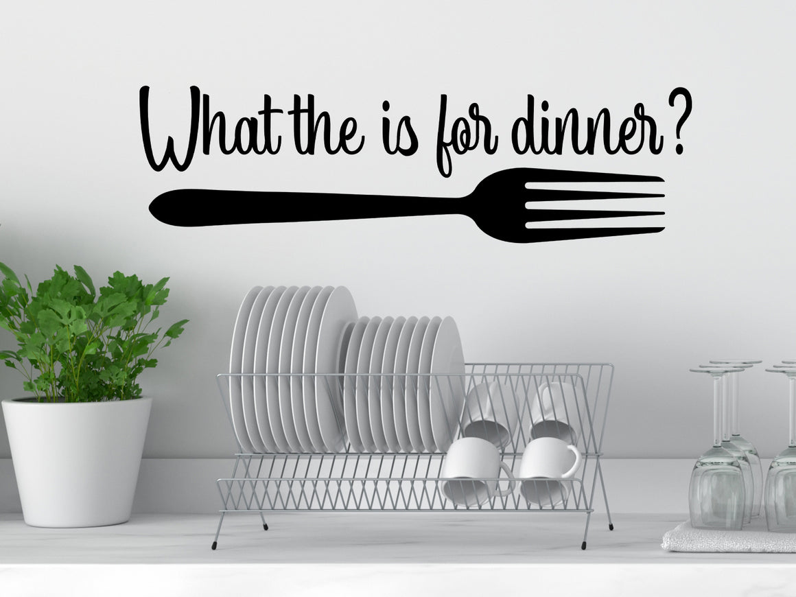 Wall decals for kitchen that say ‘What The Fork Is For Dinner’ in a cursive font on a kitchen wall.