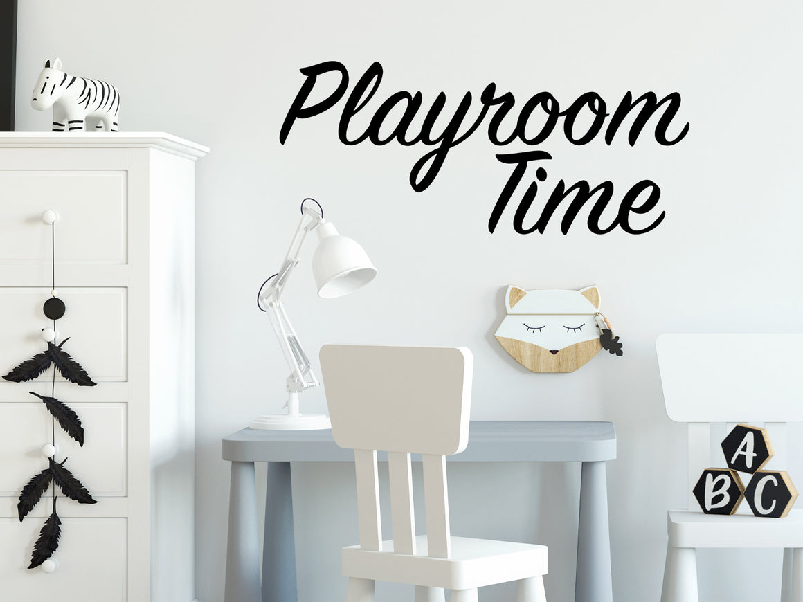 Wall decal for kids that says ‘Playroom Time Cursive’ on a kid’s room wall. 