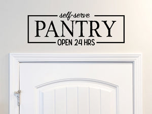 Wall decals for kitchen that say ‘The Pantry Open 24 Hours a Day’ on a kitchen wall.