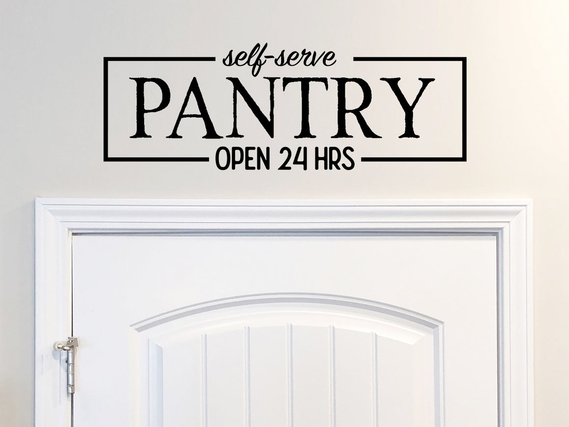 Wall decals for kitchen that say ‘The Pantry Open 24 Hours a Day’ on a kitchen wall.