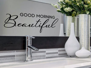 Wall decals for bathroom that say ‘Good Morning Beautiful’ in a script font on a bathroom wall.