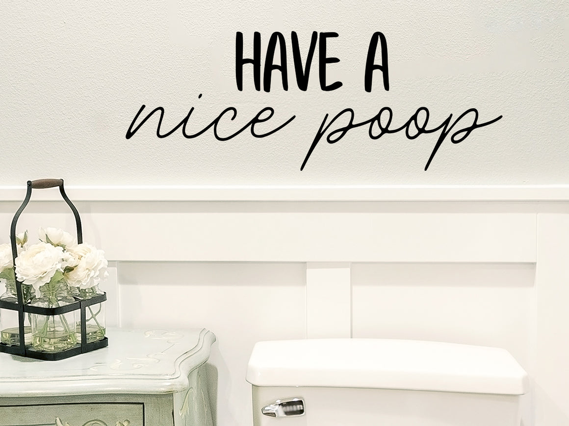 Wall decals for the bathroom that say ‘have a nice poop’ on a bathroom wall.