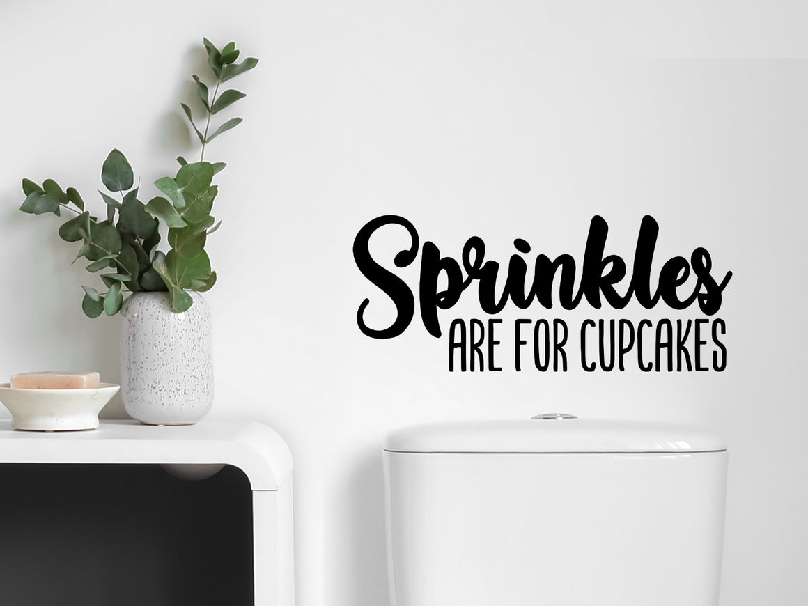 Wall decals for bathroom that say ‘sprinkles are for cupcakes’ on a bathroom wall.