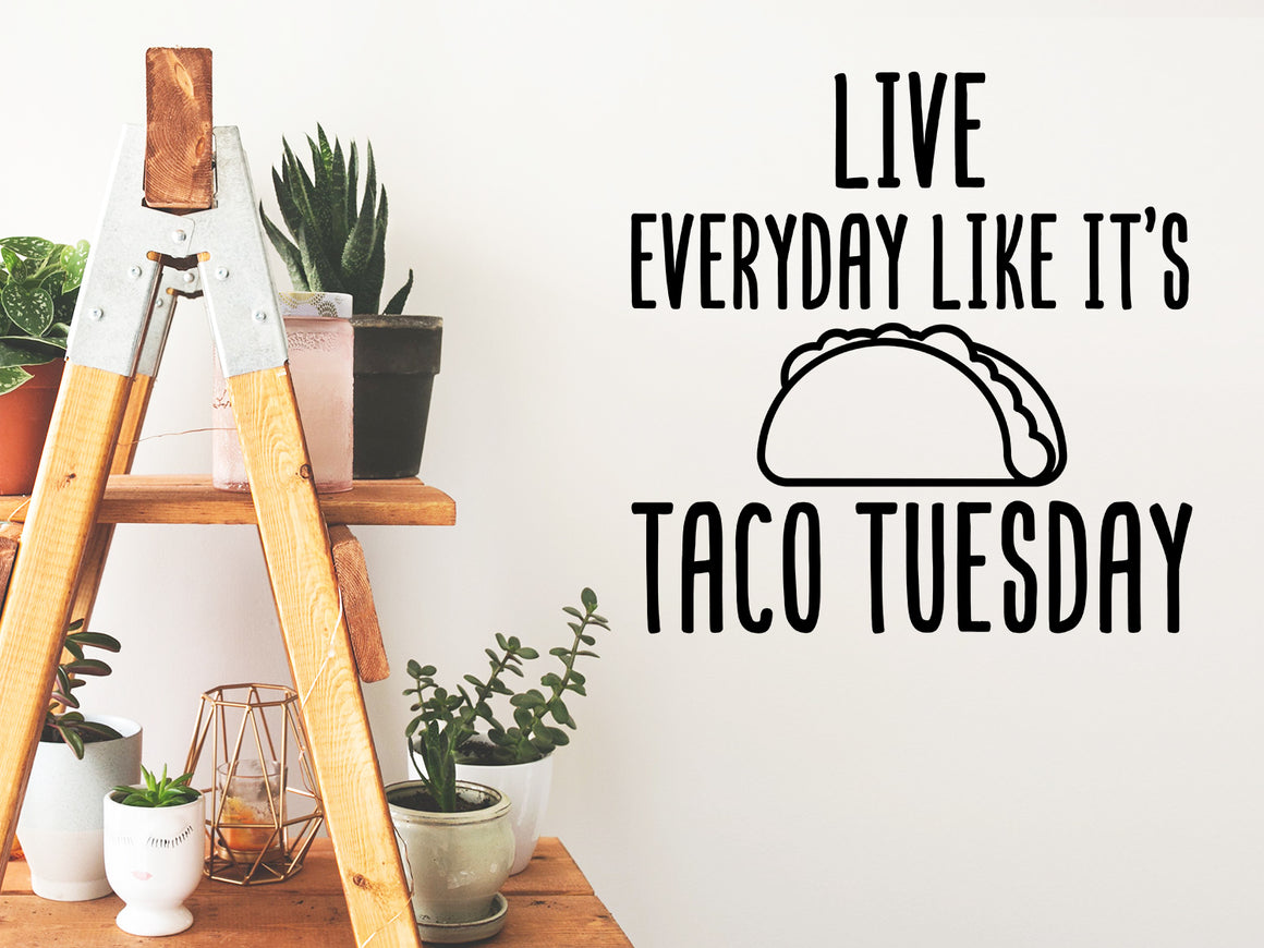 Decorative wall decal that says ‘Live Everyday Like It's Taco Tuesday’ on a kitchen wall.