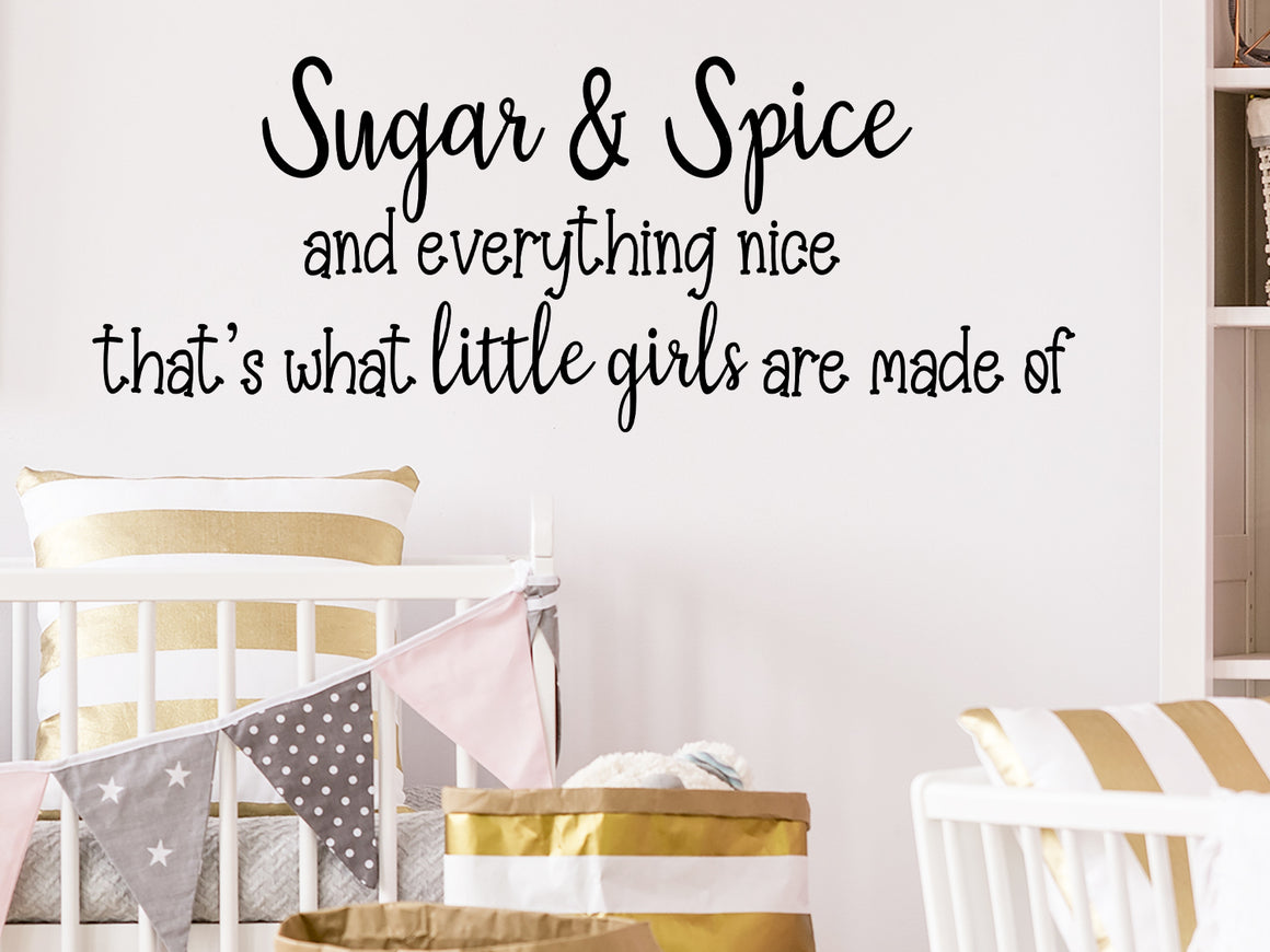 Wall decal for kids that says ‘sugar & spice and everything nice that's what little girls are made of' on a kid’s room wall. 
