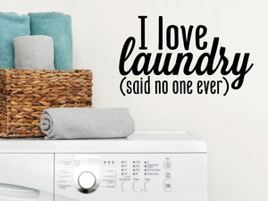 Laundry room wall decal that says ‘I Love Laundry (Said No One Ever)’ on a laundry room wall.