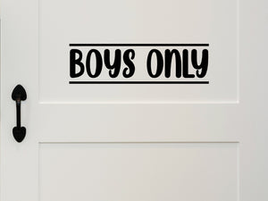 Wall decal for kids that says ‘Boys Only’ in a bold font on a kid’s room wall. 