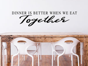 Wall decals for kitchen that say ‘dinner is better when we eat together’ on a kitchen wall.