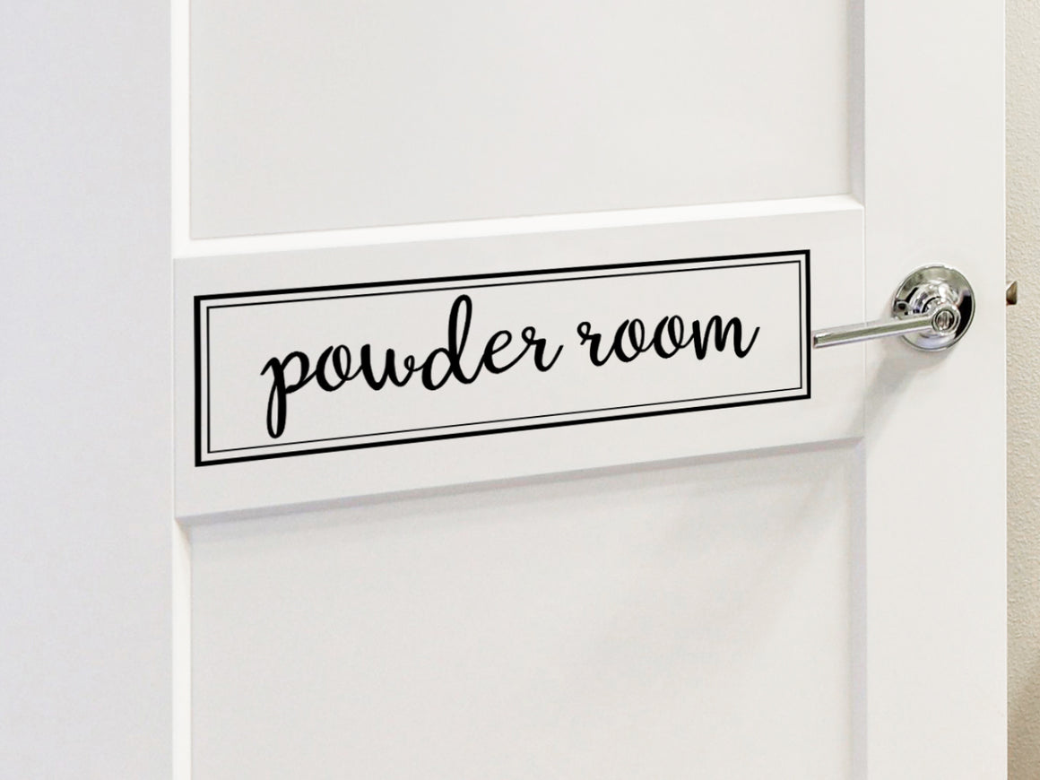 Wall decals for bathroom that say ‘powder room’ on a bathroom door.