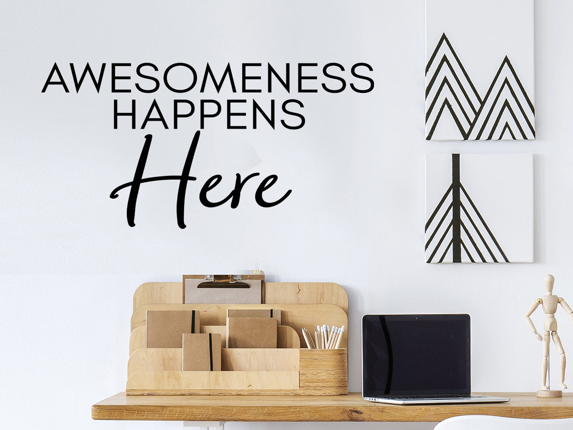 Wall decal for the office that says ‘Awesomeness Happens Here’ in a print font on an office wall.