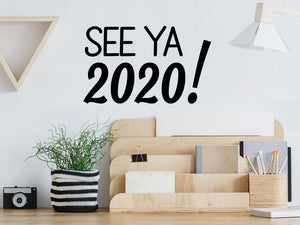 Wall decals for the office that say, 'see ya 2020!' on an office wall. 