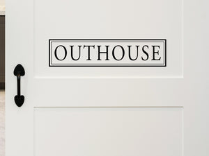 Wall decals for bathroom that say ‘Outhouse’ on a bathroom door.