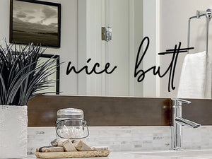 Wall decals for the bathroom that say 'Nice Butt' on a bathroom wall