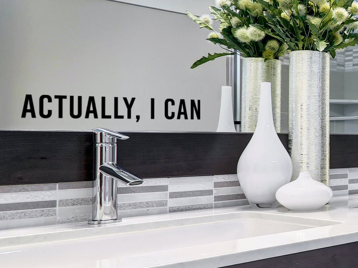 Wall decals for bathroom that say ‘Actually I Can’ on a bathroom wall.
