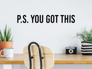 Wall decal for the office that says ‘PS You Got This’ in a bold font on an office wall.