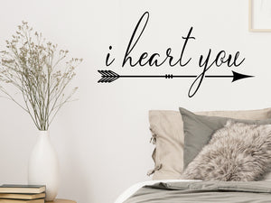 Wall decal for bedroom that says ‘I heart you’ on a bedroom wall.