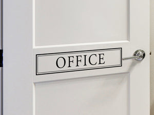 Decorative wall decal that says ‘Office’ on an office door.