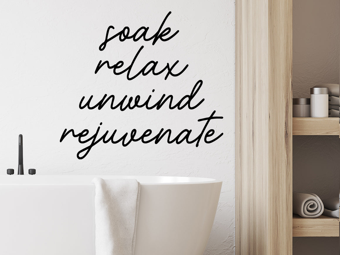 Wall decals for bathroom that say ‘soak relax unwind rejuvenate’ on a bathroom wall.