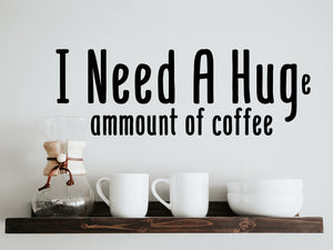 Decorative wall decal that says ‘I Need A Huge Amount Of Coffee’ on a kitchen wall.