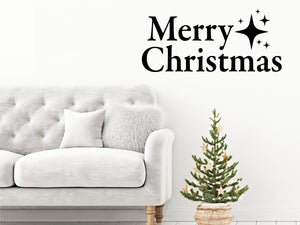 Living room wall decals that say ‘Merry Christmas’ in a print font on a living room wall. 