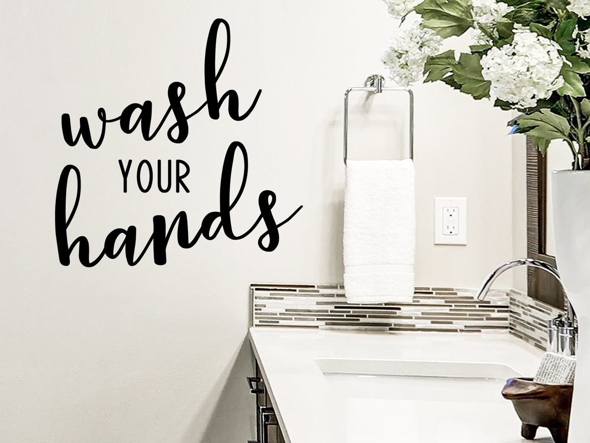 Wall decals for bathroom that say ‘wash your hands’ on a bathroom wall.