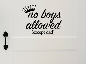 Wall decal for kids that says ‘No Boys Allowed Except Dad’ with a crown on a kid’s room wall. 