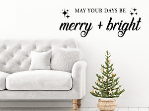 Living room wall decals that say ‘May Your Days Be Merry And Bright’ with Sparkles on a living room wall. 