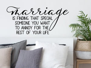 Wall decal for bedroom that says ‘marriage is finding that special someone you want to annoy for the rest of your life’ on a bedroom wall.