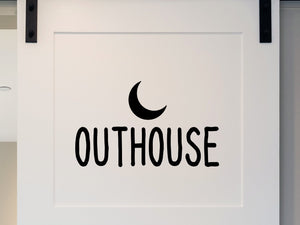 Wall decals for bathroom that say ‘outhouse’ on a bathroom wall.