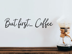 Wall decals for kitchen that say ‘But First Coffee’ in a script font on a kitchen wall.